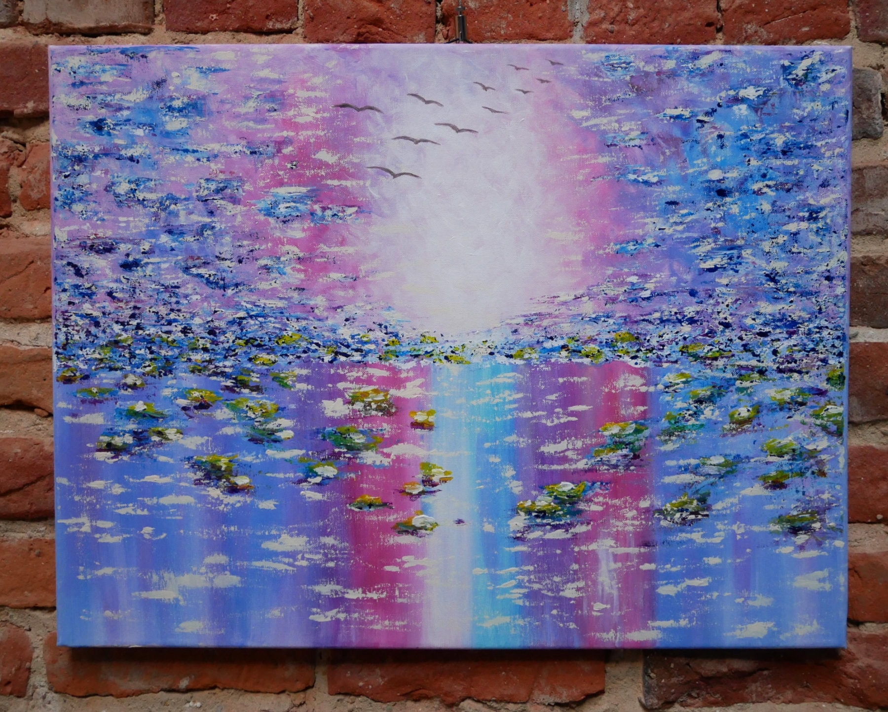 Obraz Oleny Radczenko przedstawiający kolorową wodę z nenufarami